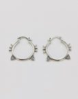 Sterling silver hoop earrings with cat ears and whiskers.