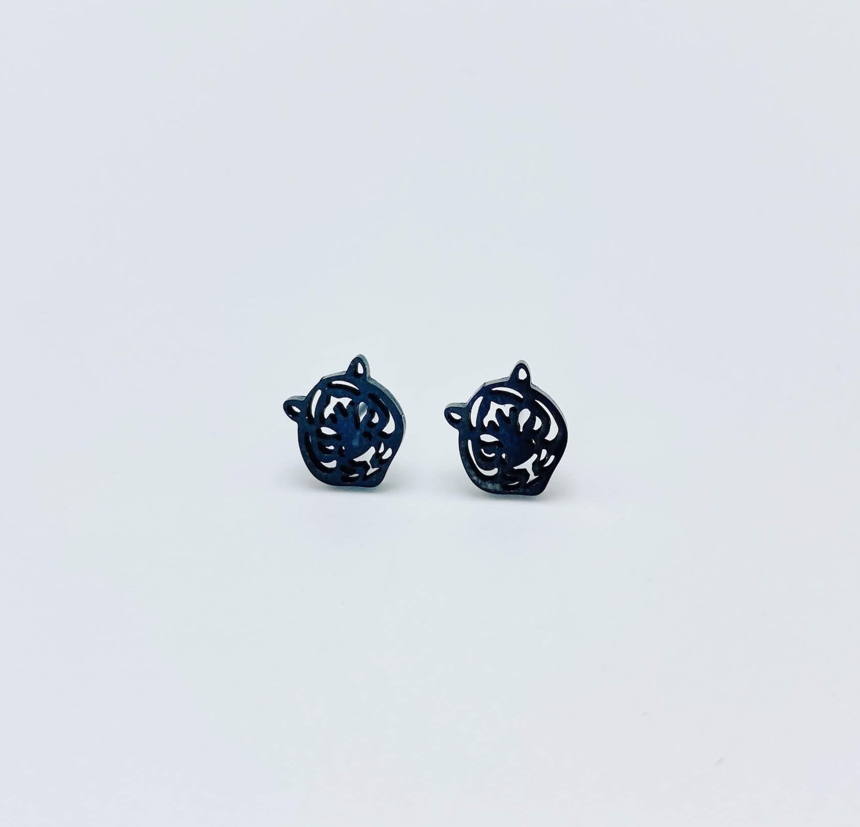 Black tiger stud earrings made from stainless steel.