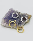 Sterling silver cat head hoop earrings in gold and silver.
