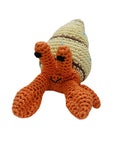 Knit Knacks "Shelly the Hermit Crab" handmade organic cotton dog toy. Smiling orange crab with pinchers in a tan shell.