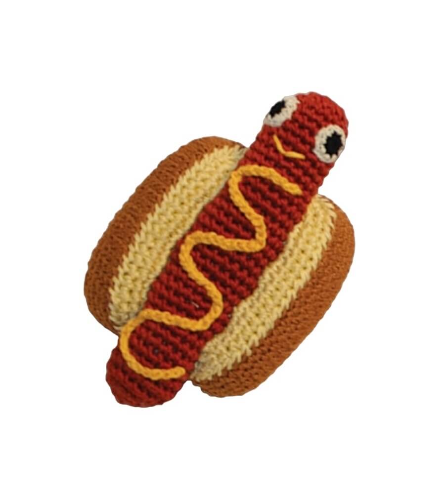 Knit Knacks "Hot Dog" handmade organic cotton dog toy. Anthropomorphic hot dog lying in a bun with mustard. Has a smiling expression on its face.