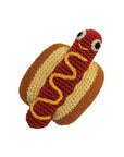 Knit Knacks "Hot Dog" handmade organic cotton dog toy. Anthropomorphic hot dog lying in a bun with mustard. Has a smiling expression on its face.