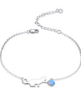 Sterling silver bracelet with cat and opal charm.