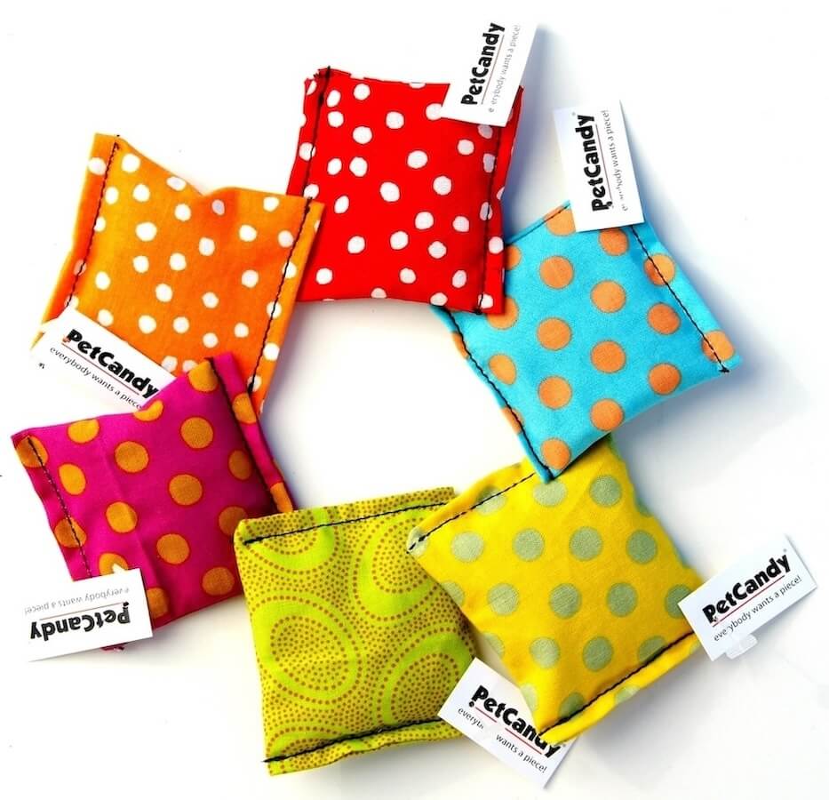 Handmade square shaped toys in various colors and patterns, stuffed with US grown, farm fresh catnip. Made in USA.