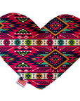 Heart shaped squeaker dog toy. Southwestern print. Main color is pink, with orange, turquoise, off-white and green accent colors. Made in USA label on bottom trim.