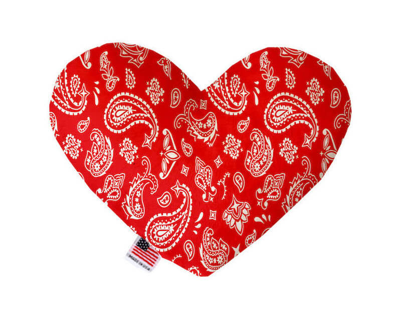 Heart shaped squeaker dog toy. Red western bandana paisley print. Made in USA label on bottom trim.