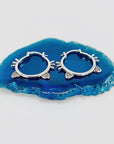 Sterling silver hoop earrings with cat ears and whiskers.