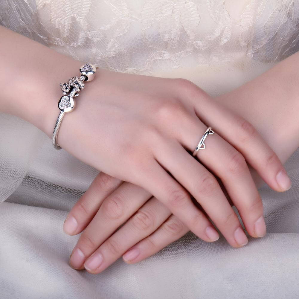 Sterling silver band ring with cat ears and hidden paw prints (worn by model).