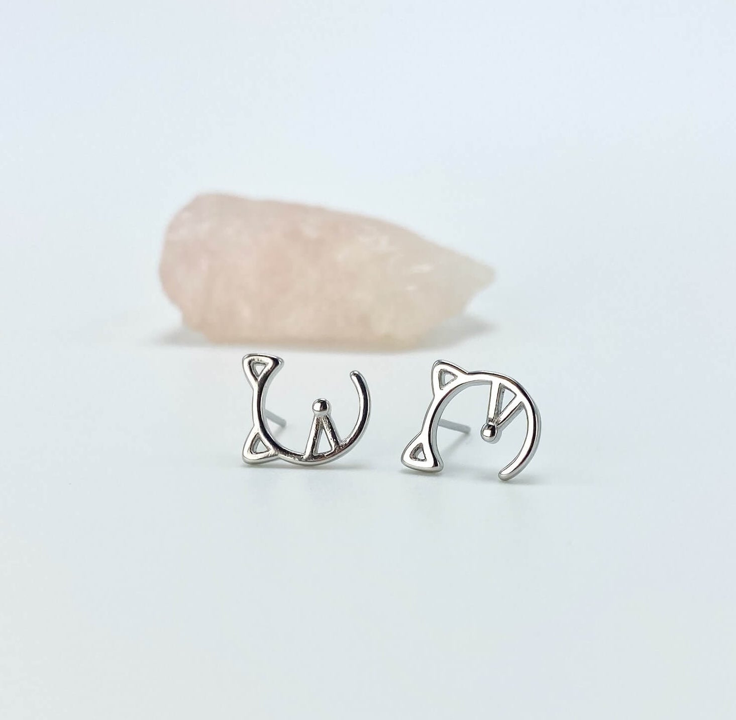 Geometric half cat face sterling silver stud earrings.