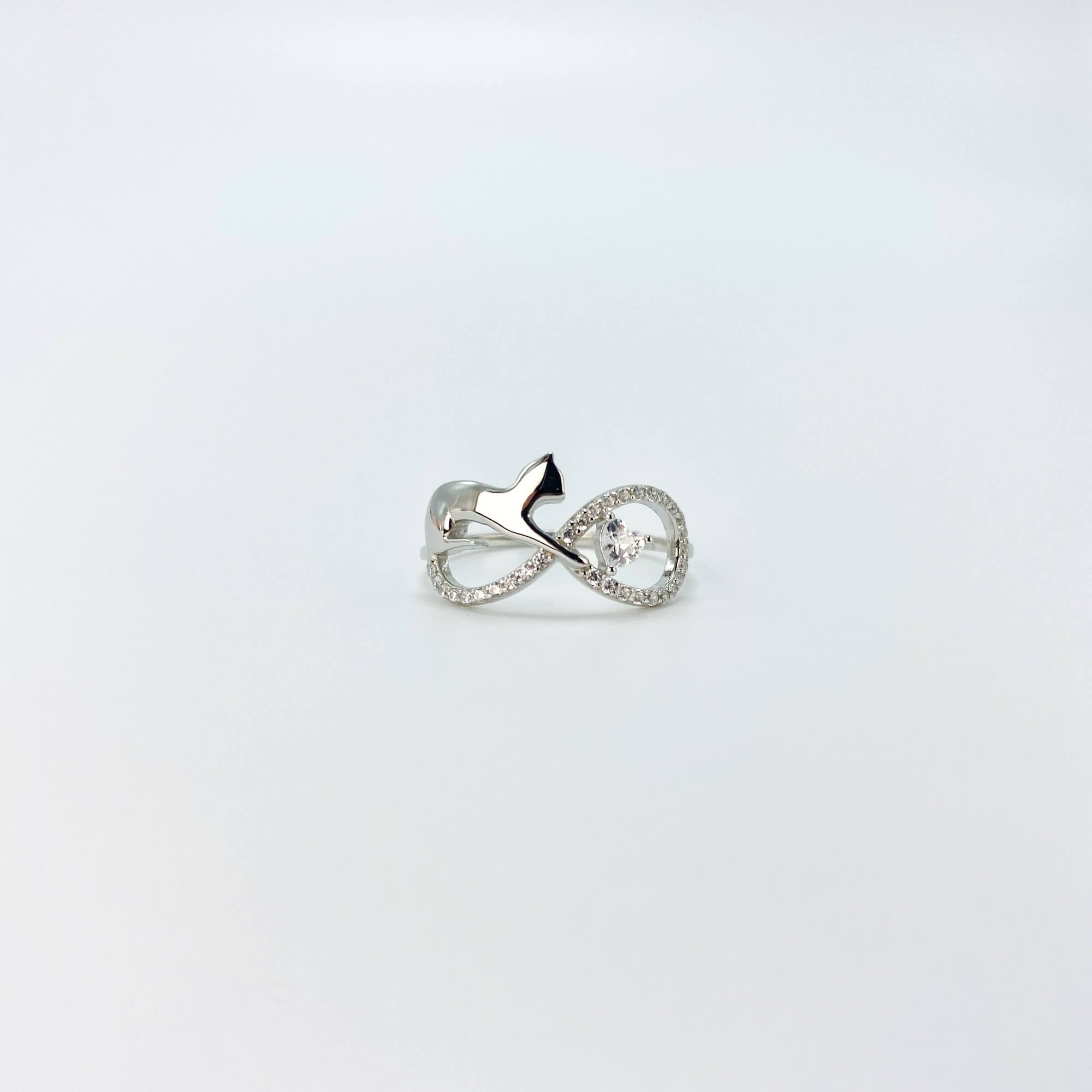 Sterling silver infinity cat ring with cubic zirconia gemstones in a pave setting.
