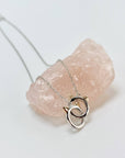 Sterling silver cat infinity necklace. Features two cat head charms that are linked.