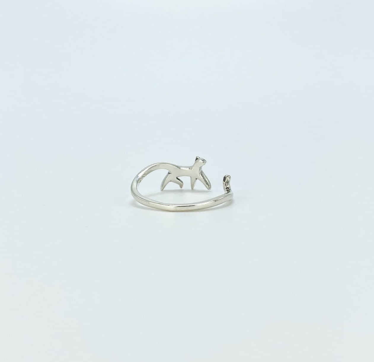 Sterling silver ring in the shape of a cat walking. Open, adjustable band.