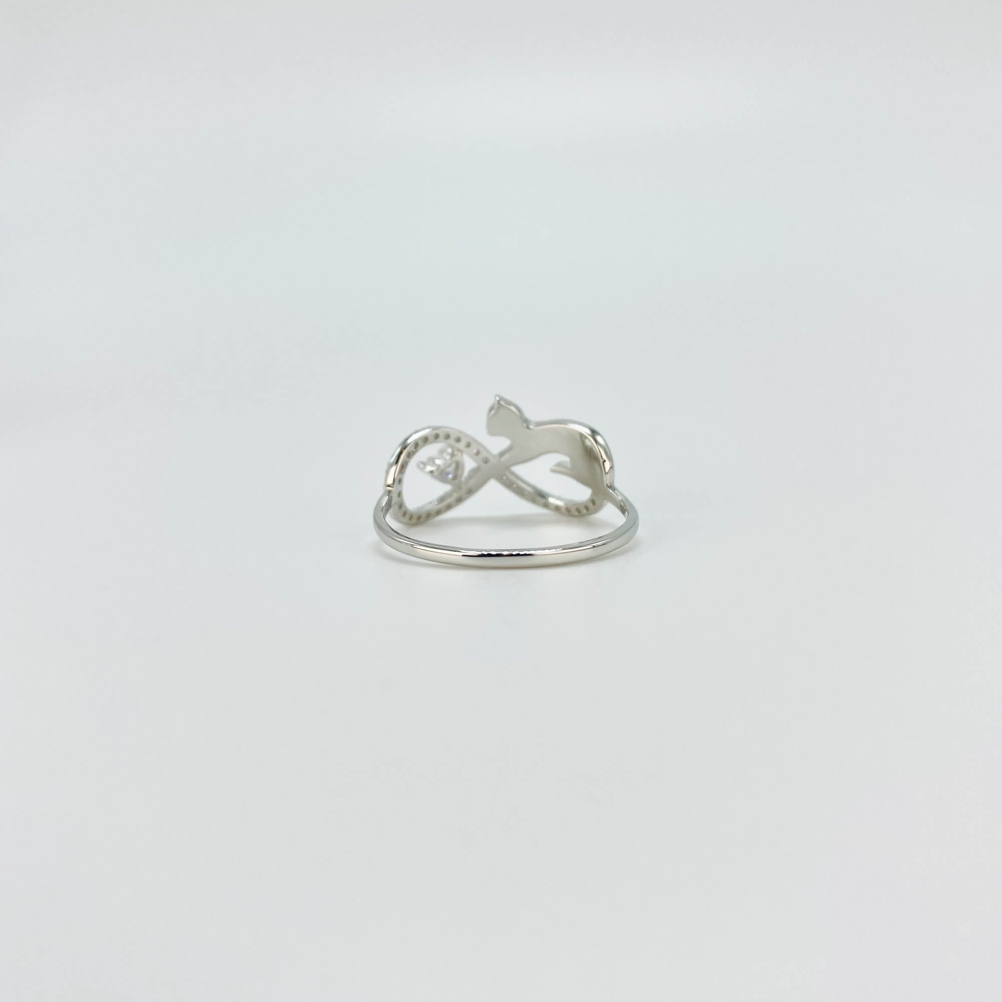 Sterling silver infinity cat ring with cubic zirconia gemstones in a pave setting.