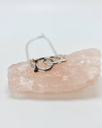 Sterling silver cat infinity necklace. Features two cat head charms that are linked.