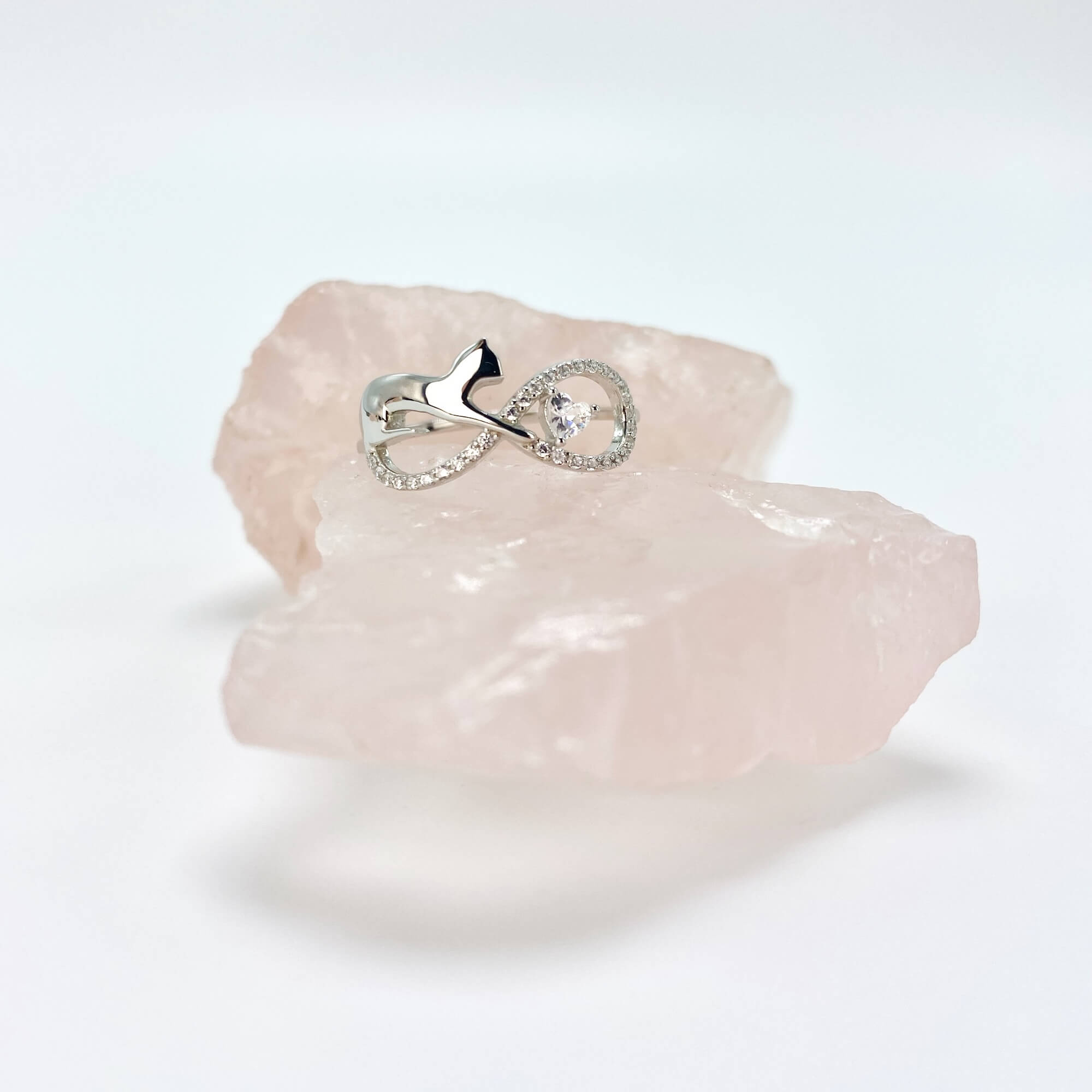 Sterling silver infinity cat ring with cubic zirconia gemstones in a pave setting.