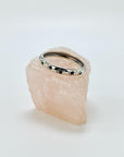 Sterling silver band ring with black enameled paw prints.