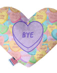 Heart shaped squeaker dog toy. Multicolored Valentine's Day candy heart background with 'Bye' heart in the center. Made in USA label on bottom trim.