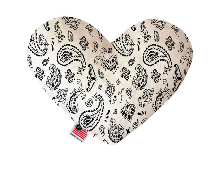 Heart shaped squeaker dog toy. White western bandana paisley print. Made in USA label on bottom trim.