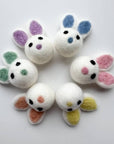 A grouping of six easter bunny felted wool cat toys.