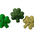 Three anthropomorphic shamrocks in different shades of green, made of wool.