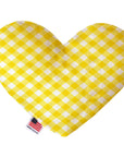 Heart shaped squeaker dog toy in a yellow and white gingham print. Made in USA label on bottom trim.