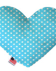 Heart shaped squeaker dog toy. Blue background with white polka dots. Made in USA label on bottom trim.