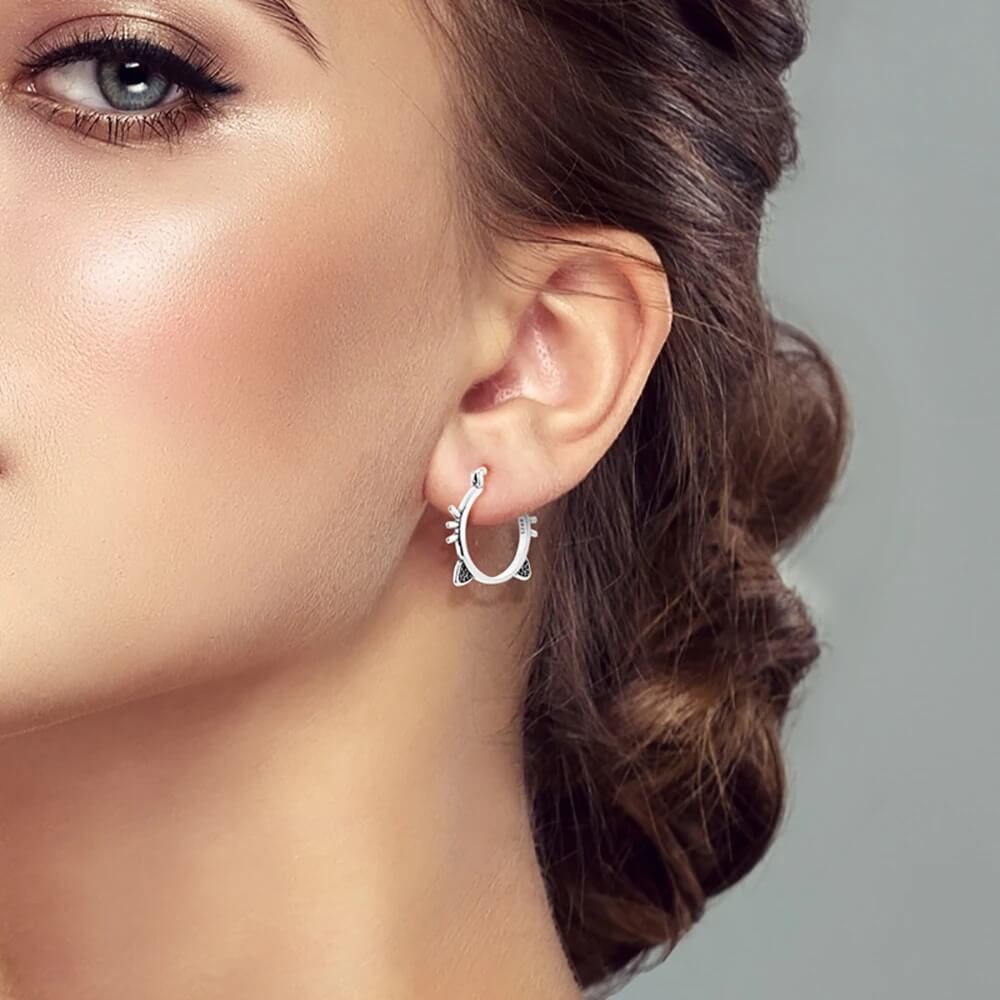 Sterling silver hoop earrings with cat ears and whiskers (worn by model).