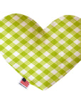 Heart shaped squeaker dog toy in a green and white gingham print. Made in USA label on bottom trim.
