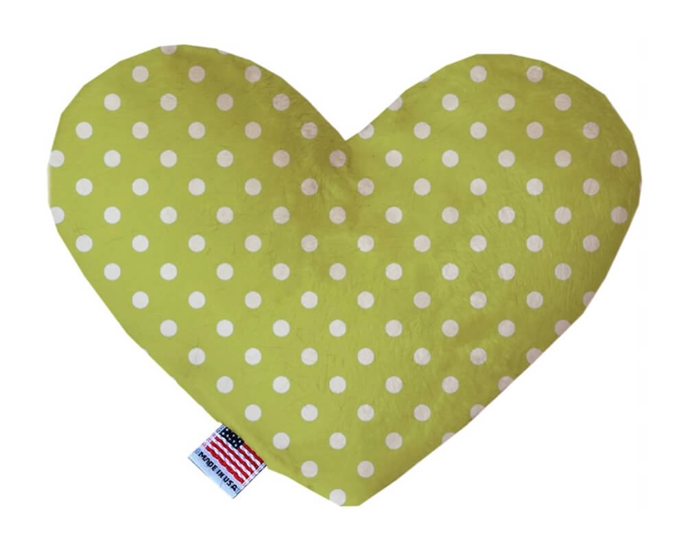 Heart shaped squeaker dog toy. Green background with white polka dots. Made in USA label on bottom trim.