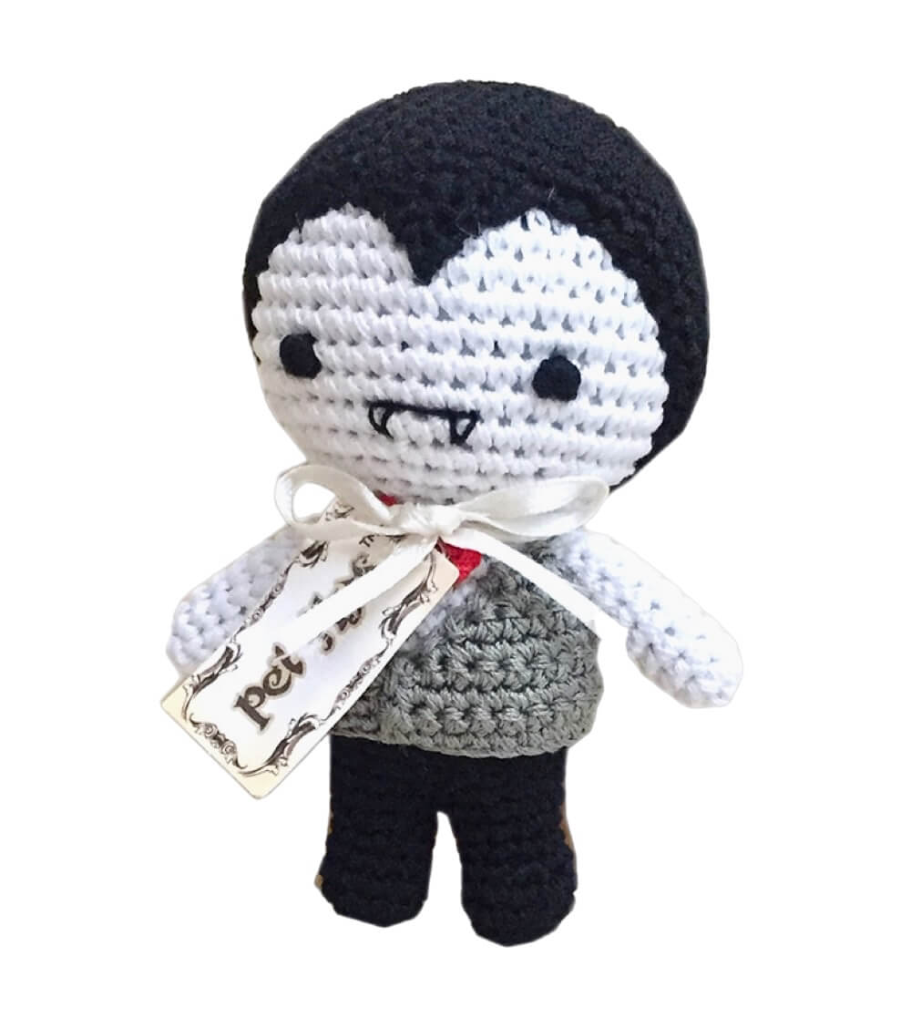Knit Knacks "Dracula" handmade organic cotton dog toy. Black and white Dracula with a gray vest and a red bow tie.