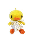 Knit Knacks "Hatch the Baby Duck" handmade organic cotton dog toy. Yellow duck with an orange beak and feet, sitting in a white egg shell.