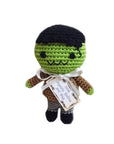 Knit Knacks "Franky the Monster" handmade organic cotton dog toy. Green Frankenstein monster with black hair, a brown jacket and gray pants.