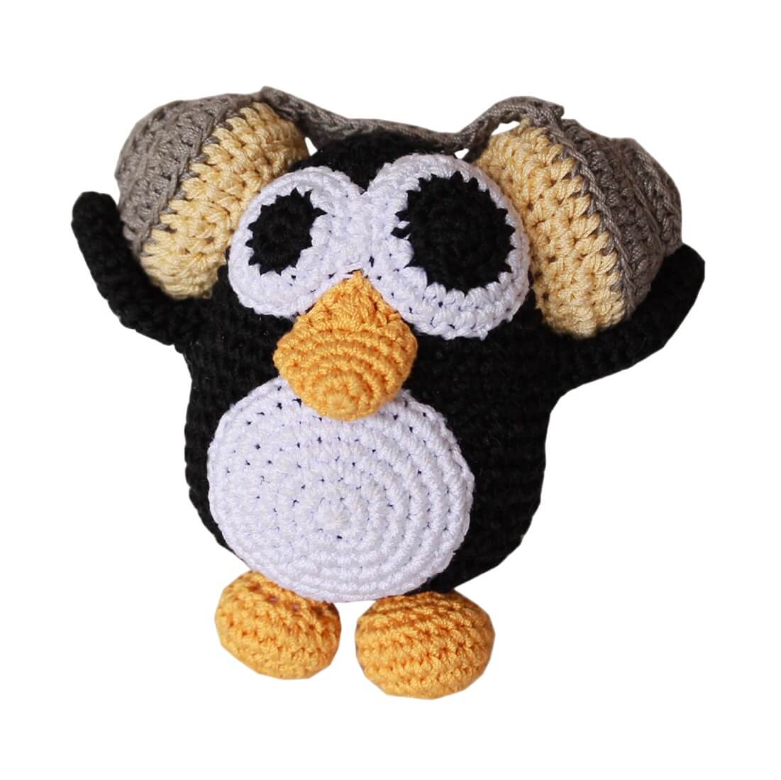 Knit Knacks "Hipster Penguin" handmade organic cotton dog toy. Black and white penguin with a yellow beak and feet, listening to music on big headphones.