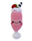 Knit Knacks "Strawberry Milkshake" handmade organic cotton dog toy. Pink milkshake with a strawberry, a black and white straw, and a smiling face with rosy cheeks.