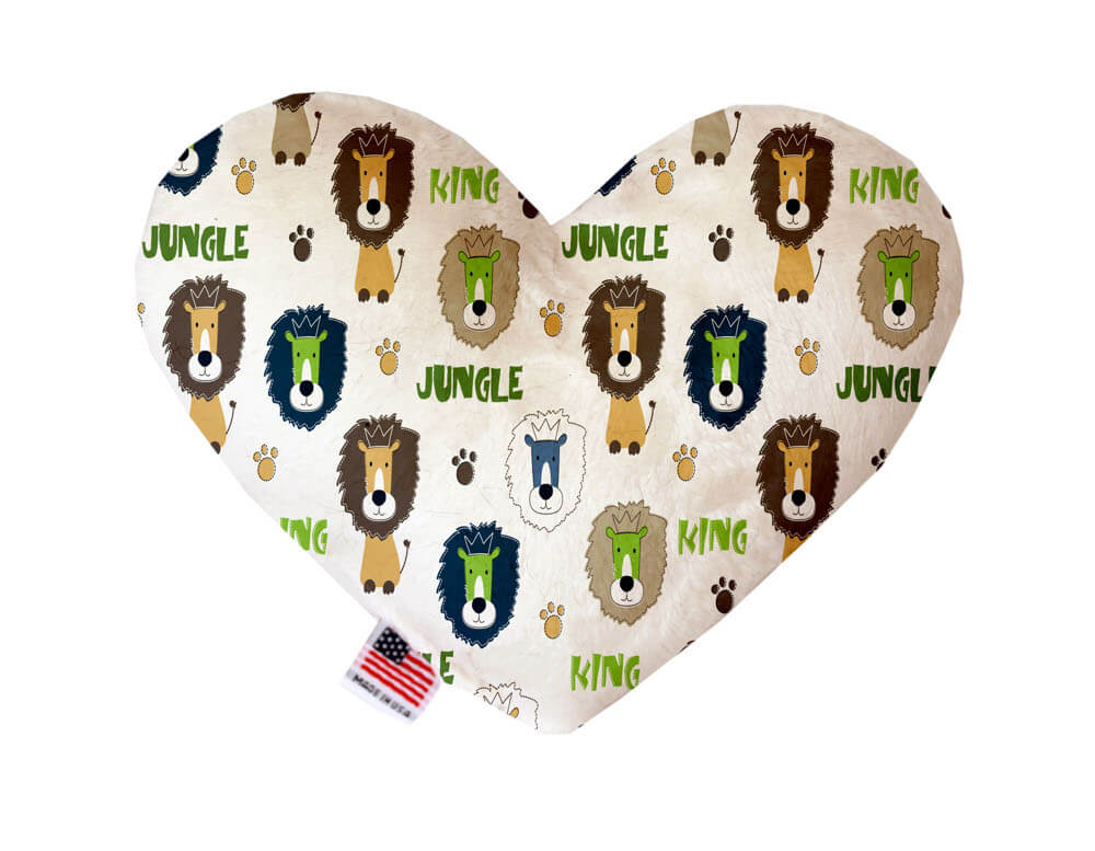 Heart shaped squeaker dog toy. White background with lions, paw prints and "jungle king" text printed throughout. Made in USA label on bottom trim.