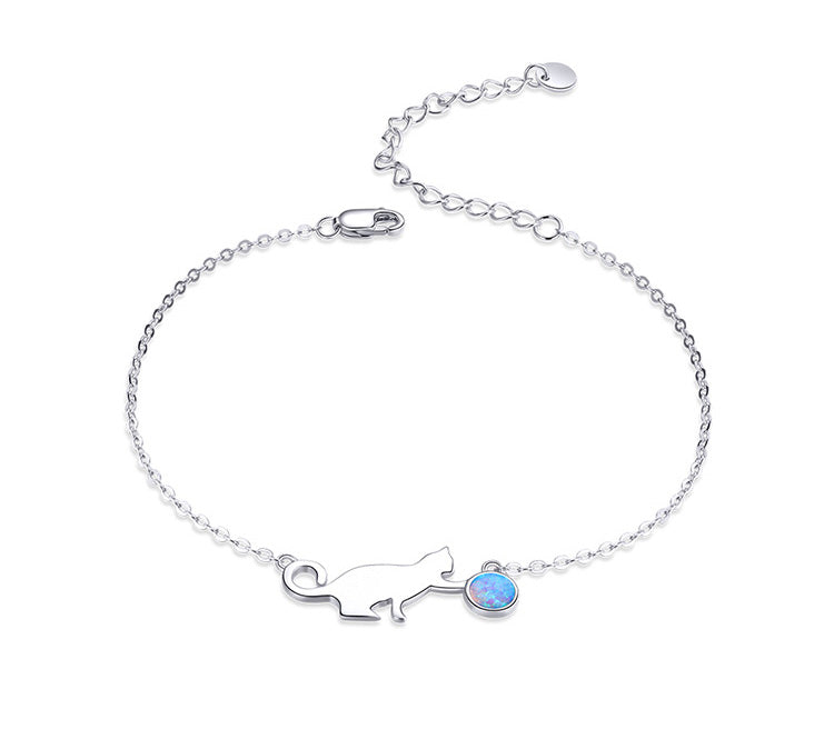 Sterling silver bracelet with cat and opal charm.