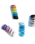 Organic wool spring cat toys in rainbow, purple, blue and neutral.