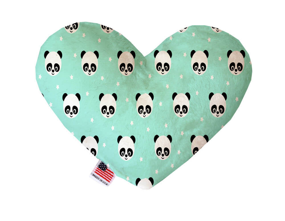 Heart shaped squeaker dog toy. Green background with white panda bears printed throughout. Made in USA label on bottom trim.