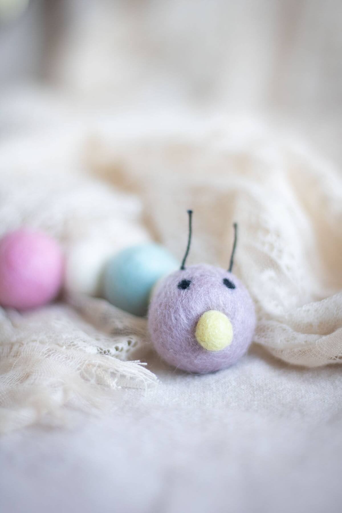 Pastel wool caterpillar cat toy.