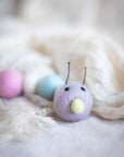 Pastel wool caterpillar cat toy.