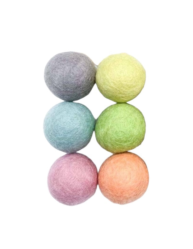 Organic wool balls in pastel hues.