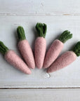 Grouping of pink carrot felted wool cat toys.
