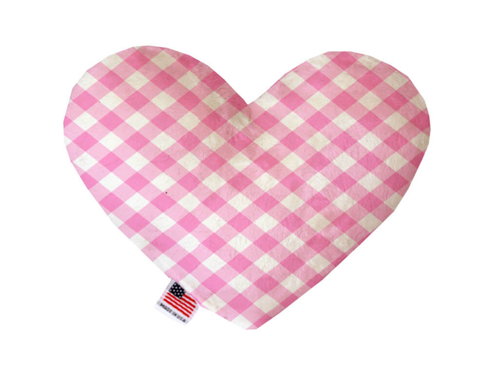 Heart shaped squeaker dog toy in a pink and white gingham print. Made in USA label on bottom trim.