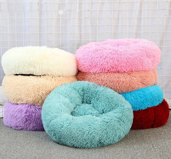 Multicolored donut plush cat/dog beds.