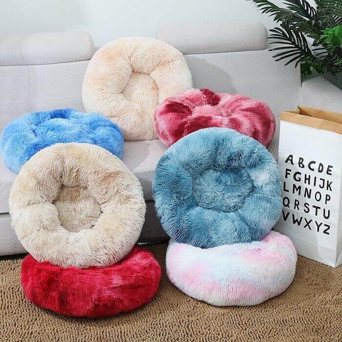 Mixed variety of plush donut cat/dog beds.