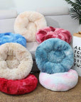 Mixed variety of plush donut cat/dog beds.