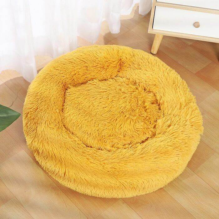 Mustard yellow donut plush cat/dog bed.