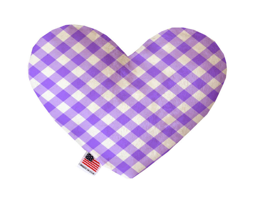 Heart shaped squeaker dog toy in a purple and white gingham print. Made in USA label on bottom trim.