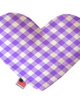 Heart shaped squeaker dog toy in a purple and white gingham print. Made in USA label on bottom trim.