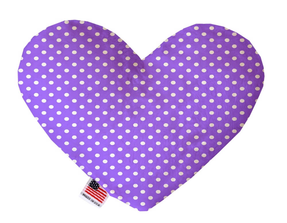 Heart shaped squeaker dog toy. Purple background with white polka dots. Made in USA label on bottom trim.